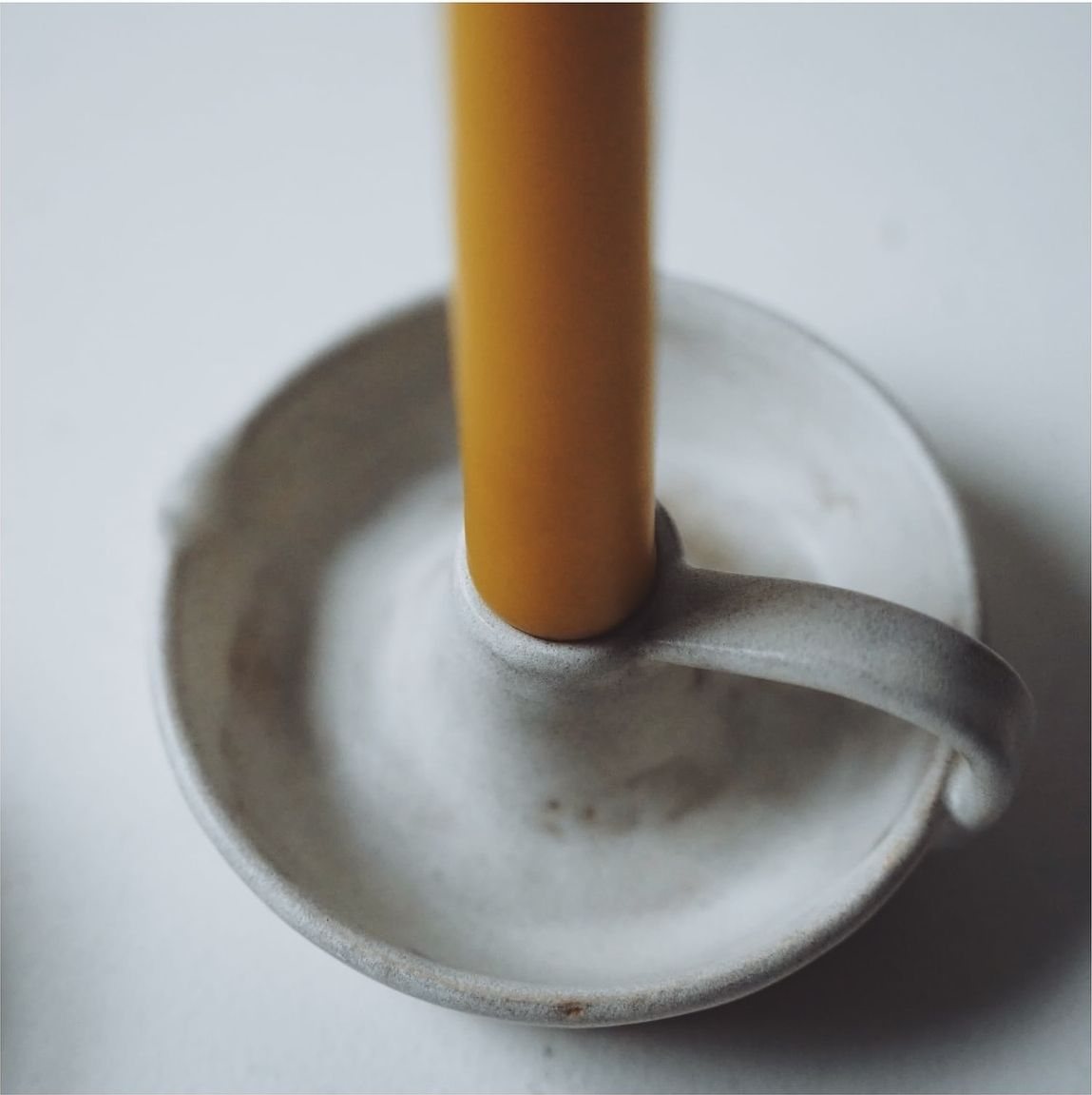 A ceramic candle holder handcrafted in Yorkshire, from the Skär Organics collaboration with Lizzie Fry Ceramics